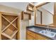 Home wet bar with a sink, drawers and wood cabinetry, and wine racks at 2830 Scottish Mill Way, Marietta, GA 30068