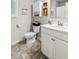 Bright bathroom with a white vanity, toilet, and tile flooring at 4365 Sunflower Cir, Cumming, GA 30040