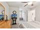 Serene bedroom with ample natural light, stylish decor, and a view at 4365 Sunflower Cir, Cumming, GA 30040