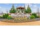 Beautiful Bramblett Grove entrance with a cascading waterfall feature and lush landscaping creates an inviting first impression at 4365 Sunflower Cir, Cumming, GA 30040