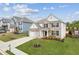 Beautiful two-story home boasts a well-kept lawn, attractive landscaping, and classic design elements at 4365 Sunflower Cir, Cumming, GA 30040