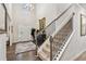 Grand foyer featuring a staircase, hardwood floors, a decorative rug, and an elegant chandelier at 4365 Sunflower Cir, Cumming, GA 30040