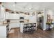 Bright kitchen with white cabinets, granite counters, stainless appliances, and island with bar seating at 4365 Sunflower Cir, Cumming, GA 30040