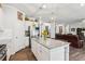 Open-concept kitchen features a granite island, stainless appliances, and hardwood floors at 4365 Sunflower Cir, Cumming, GA 30040