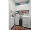 Functional laundry room with modern appliances and ample storage for convenience at 4365 Sunflower Cir, Cumming, GA 30040