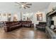 Spacious living room with hardwood floors, ceiling fan, and comfortable seating area at 4365 Sunflower Cir, Cumming, GA 30040