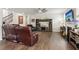 Comfortable living room features hardwood floors, a ceiling fan, and an entertainment center at 4365 Sunflower Cir, Cumming, GA 30040