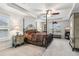 Spacious main bedroom with tray ceiling, ceiling fan, and large windows for natural light at 4365 Sunflower Cir, Cumming, GA 30040