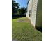 Side view of a backyard featuring a patio, grass, and the side of the home at 978 Francis Ln, Fairburn, GA 30213