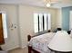 Bedroom featuring a window with shutters, a ceiling fan, and a bed at 978 Francis Ln, Fairburn, GA 30213