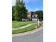 Traditional two-story home with a manicured lawn, a two-car garage and classic architectural details at 978 Francis Ln, Fairburn, GA 30213