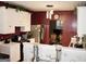 Stylish kitchen with white cabinets, stainless steel appliances, and modern lighting at 978 Francis Ln, Fairburn, GA 30213
