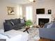 Inviting living room features a fireplace, plush seating, and ample natural light at 978 Francis Ln, Fairburn, GA 30213