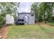 Expansive backyard with multi-level deck, surrounded by mature trees offering privacy at 1612 Branch Creek Cv, Lawrenceville, GA 30043