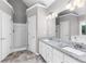 Bathroom with shower and tub, double vanity and granite countertops, and neutral color scheme at 1612 Branch Creek Cv, Lawrenceville, GA 30043