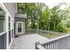 Well-maintained deck area, perfect for outdoor relaxation, with view of trees at 1612 Branch Creek Cv, Lawrenceville, GA 30043