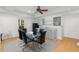 Dining area features a modern glass table with seating for six and a convenient kitchenette at 1612 Branch Creek Cv, Lawrenceville, GA 30043