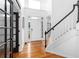 Bright and airy foyer with hardwood floors and staircase at 1612 Branch Creek Cv, Lawrenceville, GA 30043