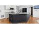 Kitchen island with granite countertops and modern fixtures at 1612 Branch Creek Cv, Lawrenceville, GA 30043