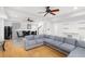 Open-concept living space with a seating area, dining table, kitchenette, and stairs at 1612 Branch Creek Cv, Lawrenceville, GA 30043