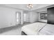 Spacious main bedroom with new carpet leading to connected bathroom and large bright window at 1612 Branch Creek Cv, Lawrenceville, GA 30043