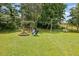 Backyard with hammock, swing, and firepit at 3411 Morgan Rd, Canton, GA 30115