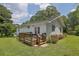 Exterior shot of a white house with a back deck and flower bed at 3411 Morgan Rd, Canton, GA 30115
