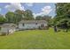 Spacious backyard featuring a fire pit and detached storage shed at 3411 Morgan Rd, Canton, GA 30115