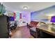 Finished basement with unique wall art, desk space, and comfortable seating at 3411 Morgan Rd, Canton, GA 30115