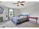 Bright and airy bedroom featuring plush carpet, stylish decor, and natural light at 3411 Morgan Rd, Canton, GA 30115