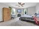 Spacious bedroom with natural light, plush carpeting, and ample storage at 3411 Morgan Rd, Canton, GA 30115