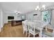Inviting dining area with ample natural light and a view into the cozy living room at 3411 Morgan Rd, Canton, GA 30115