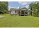Charming home with a welcoming front porch and lush green lawn, perfect for outdoor living at 3411 Morgan Rd, Canton, GA 30115