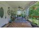 Cozy front porch with seating, a ceiling fan, and decorative accents, perfect for relaxing outdoors at 3411 Morgan Rd, Canton, GA 30115
