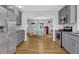 Bright kitchen featuring stainless steel appliances, stone countertops, and a view into the dining room at 3411 Morgan Rd, Canton, GA 30115