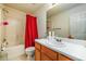 The bathroom features a single sink vanity, a shower over tub, and neutral-toned walls and floors at 455 Lakeside Cir, Covington, GA 30016