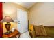 Entryway features a white front door, side table with lamp, and cozy seating area at 455 Lakeside Cir, Covington, GA 30016