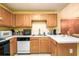 Kitchen view highlighting the cabinetry, countertops, and appliances, blending functionality with style at 455 Lakeside Cir, Covington, GA 30016