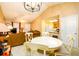 Open-concept living room with dining area and a view into the kitchen at 455 Lakeside Cir, Covington, GA 30016