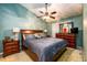 The main bedroom has a ceiling fan, an en-suite bathroom, and carpeted floors at 455 Lakeside Cir, Covington, GA 30016