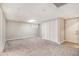 Spacious basement room with carpeted floors, ample lighting, and closet space at 647 Sunshine Nw Trce, Acworth, GA 30102