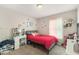 Bedroom with neutral walls, plush carpet, window, ceiling fan and fun wall art at 647 Sunshine Nw Trce, Acworth, GA 30102