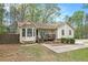 View of the front exterior of a house with a covered front porch and bay window at 647 Sunshine Nw Trce, Acworth, GA 30102