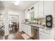 Clean kitchen with wood flooring, light countertops and bright white cabinets at 647 Sunshine Nw Trce, Acworth, GA 30102