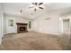 Inviting living room features a brick fireplace, vaulted ceiling, and ample natural light at 647 Sunshine Nw Trce, Acworth, GA 30102
