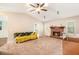 Cozy living room with vaulted ceilings, ceiling fan, fireplace and lots of natural light at 647 Sunshine Nw Trce, Acworth, GA 30102