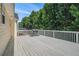 Spacious wooden back deck perfect for outdoor entertaining, complete with a grill at 7835 Teton Trl, Douglasville, GA 30134