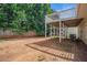 View of the backyard with a spacious patio under the home's back deck at 7835 Teton Trl, Douglasville, GA 30134