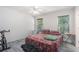 This bedroom offers natural light and has grey laminate flooring at 7835 Teton Trl, Douglasville, GA 30134
