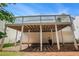 View of the back exterior featuring the upper-level deck and back of the house at 7835 Teton Trl, Douglasville, GA 30134